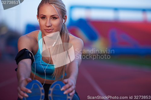 Image of sporty woman on athletic race track
