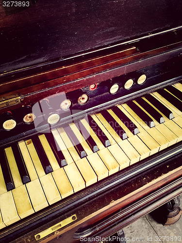 Image of Antique reed organ keyboard and stops