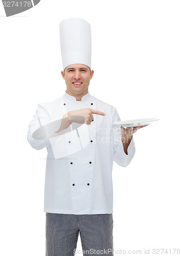Image of happy male chef cook showing empty plate
