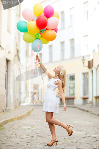 Image of woman with colorful balloons