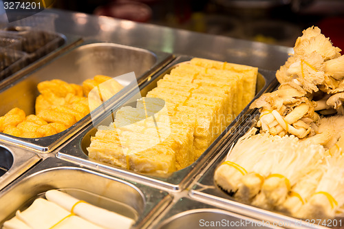 Image of spring rolls and snacks at street market