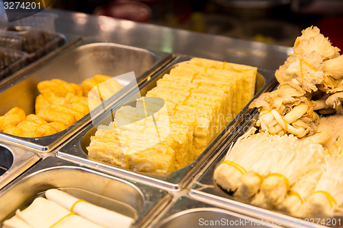 Image of spring rolls and snacks at street market