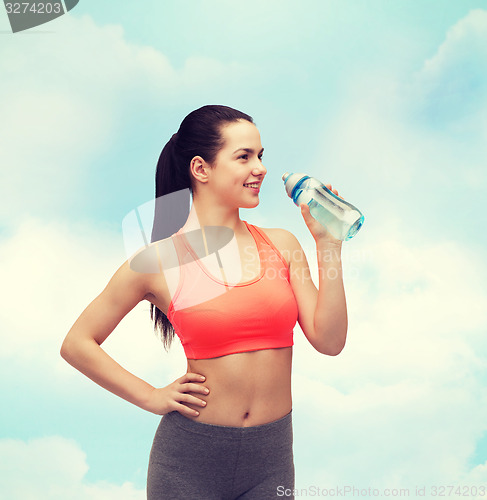 Image of sporty woman with water bottle