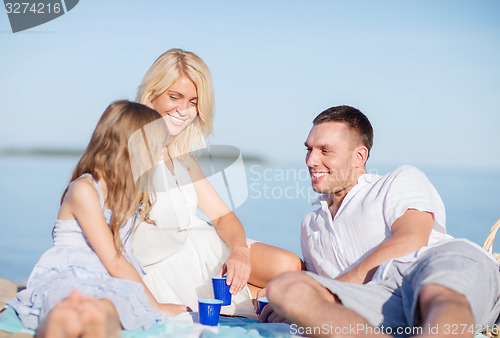 Image of happy family having a picnic