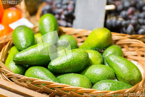 Image of avocado in basket at food market
