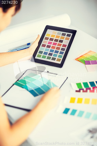 Image of woman working with color samples for selection