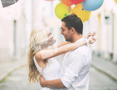 Image of couple with colorful balloons