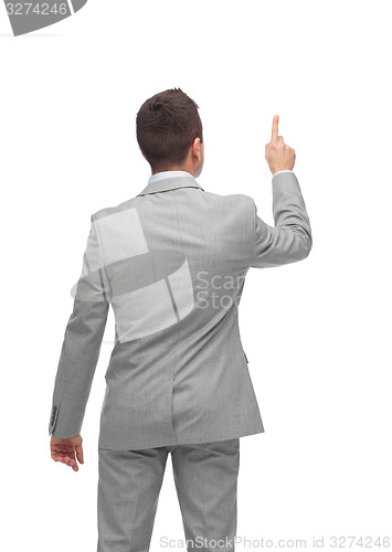 Image of businessman pointing finger or touching something