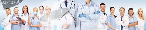 Image of nurse and male doctor holding cardiogram