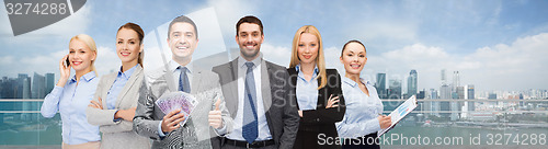 Image of smiling businessman with american dollar money