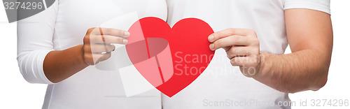 Image of closeup of couple hands with heart