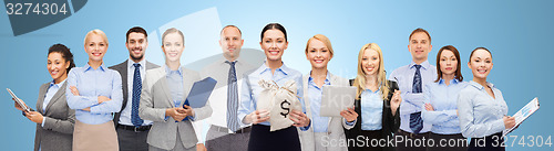 Image of group of happy businesspeople with money bags