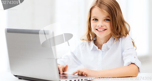 Image of girl with laptop pc at school
