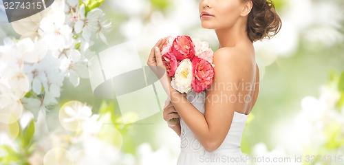 Image of bride or woman with bouquet of flowers