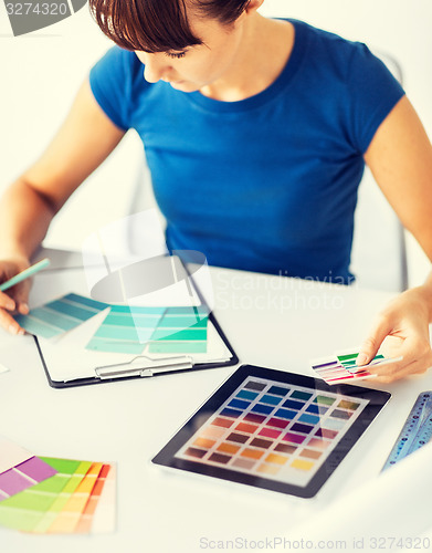 Image of woman working with color samples for selection