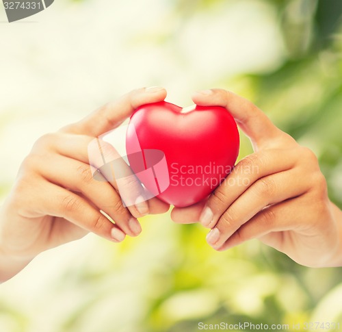 Image of woman hands with heart