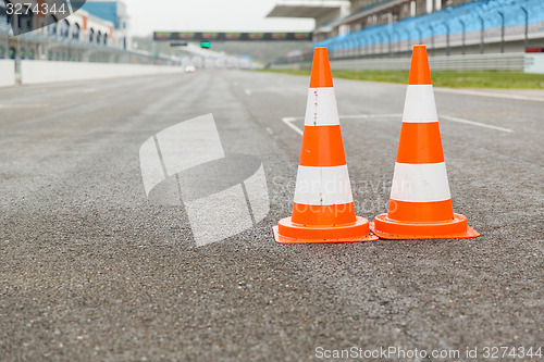 Image of traffic cones on speedway of stadium