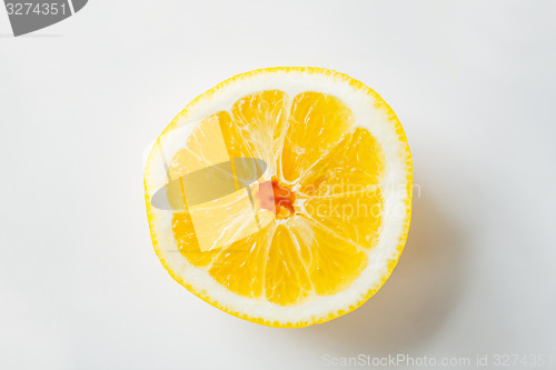 Image of ripe orange or lemon slice over white