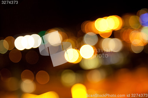 Image of golden bright lights on dark night background