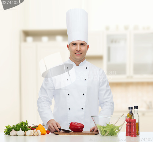 Image of happy male chef cook cooking food