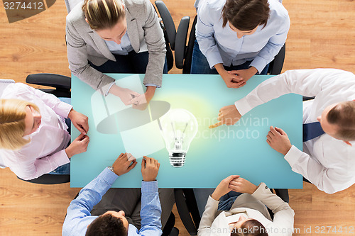Image of close up of business team sitting at table