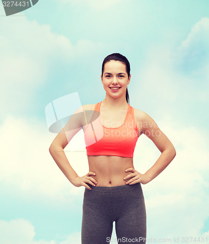 Image of smiling teenage girl in sportswear