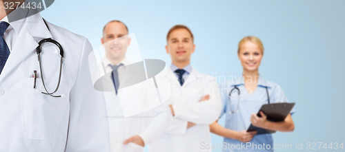 Image of group of happy medics in white coats