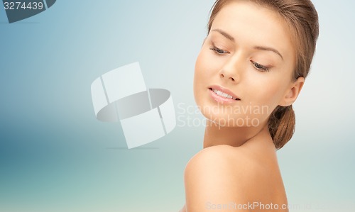 Image of beautiful young woman face with bare shoulder