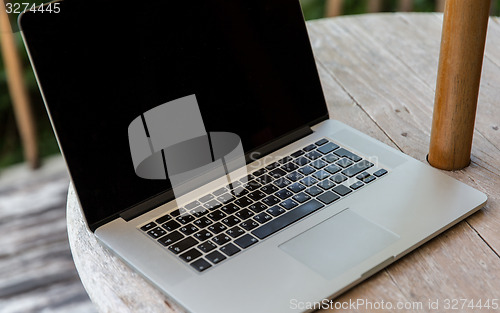 Image of close up of laptop computer on table at hotel