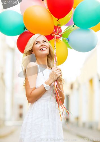 Image of woman with colorful balloons