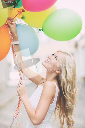 Image of woman with colorful balloons