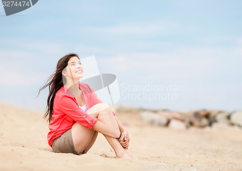 Image of girl sitting on the beach