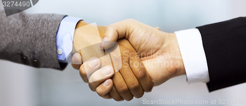 Image of businessman and businesswoman shaking hands