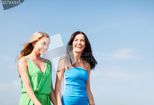 Image of girls walking on the beach