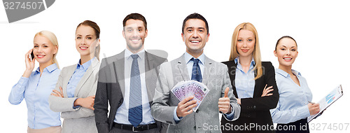 Image of smiling businessman with american dollar money