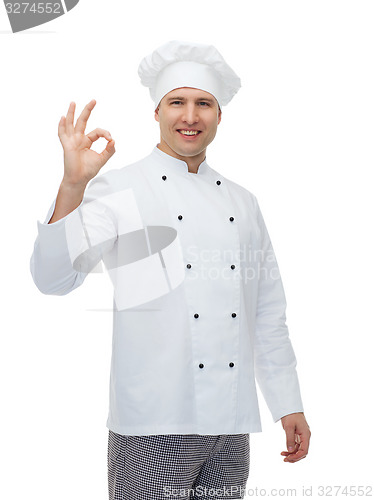 Image of happy male chef cook showing ok sign