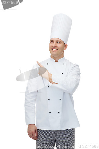 Image of happy male chef cook pointing finger up