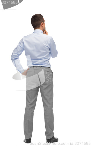Image of businessman thinking from back