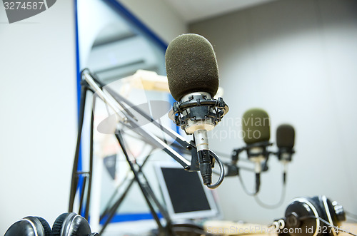 Image of microphone at recording studio or radio station