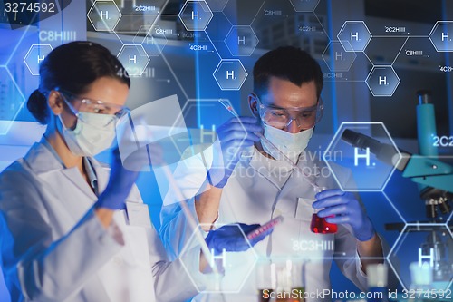 Image of close up of scientists making test in lab