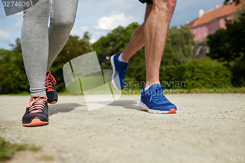 Image of close up of couple running outdoors