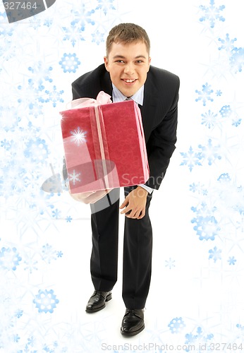 Image of businessman with pink gift package and snowflakes