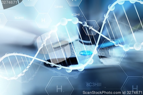 Image of close up of scientist hand with test sample in lab