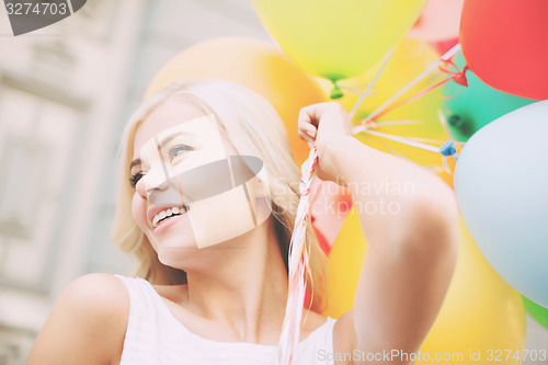 Image of woman with colorful balloons