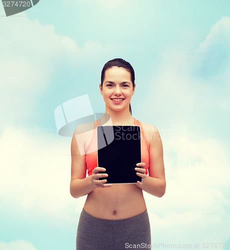 Image of sporty woman with tablet pc blank screen