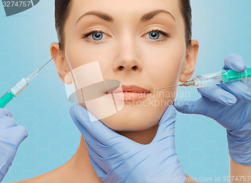 Image of woman face and surgeon hands with syringes