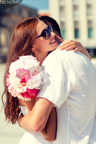 Image of smiling couple in city