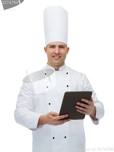 Image of happy male chef cook holding tablet pc