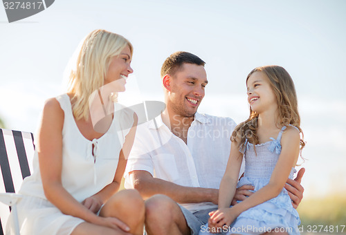 Image of happy family having a picnic