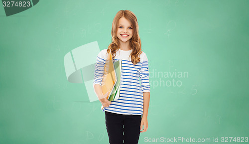 Image of happy girl holding colorful folders